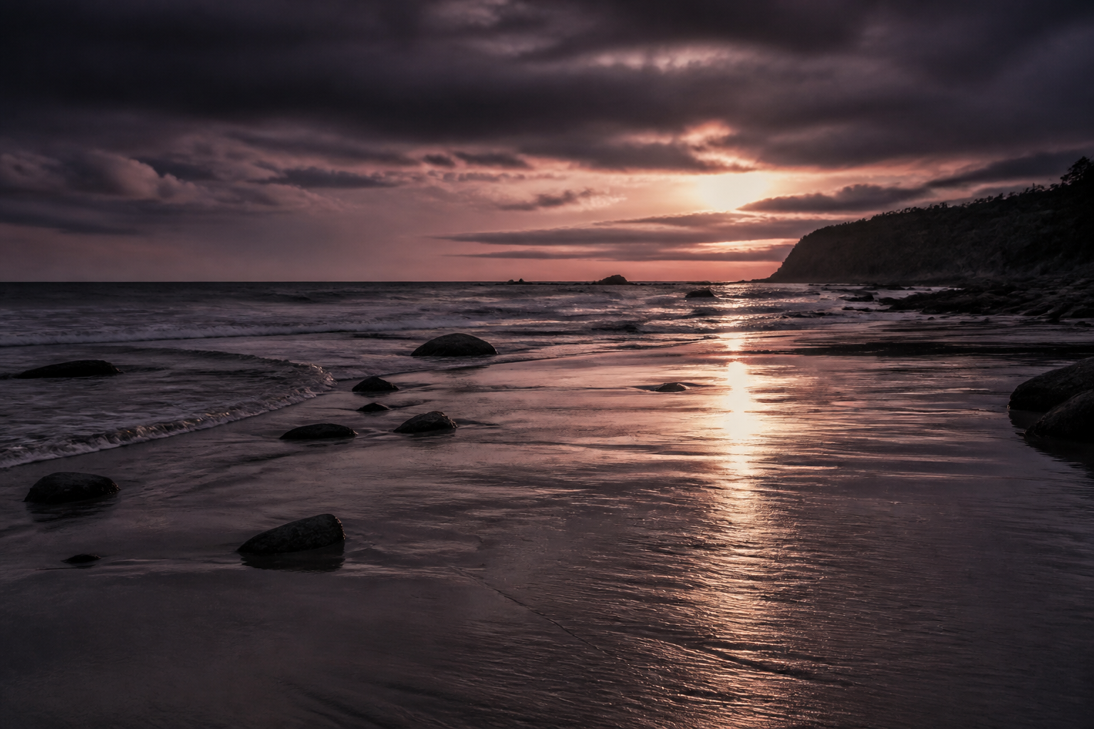 Gentle waves beneath a warm dusk sky